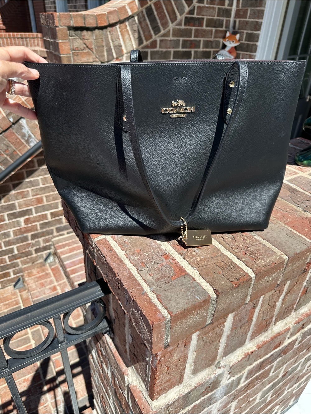 Coach Black Leather Tote with Gold Logo and Charm